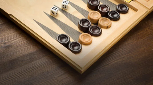Play Backgammon, a classic board game of strategy and luck. Move your pieces wisely and bear them off the board before your opponent.